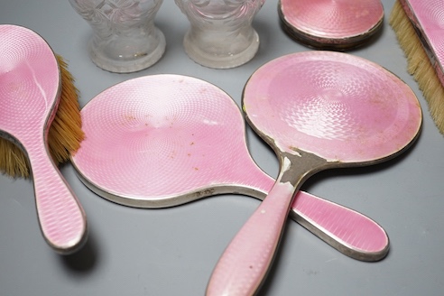 A George silver and enamel mounted glass part dressing table set, by Henry Clifford Davis and a similar American hand mirror.